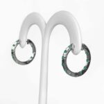 side view of white gold emerald hoop earrings