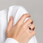 rose gold rhodolite garnet ring on finger