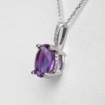 side view of amethyst and diamond pendant