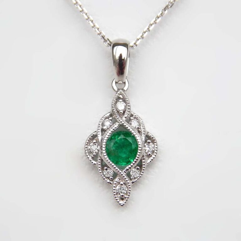 white gold emerald and diamond art deco pendant