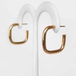 side view of yellow gold square hoop earrings