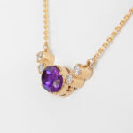 side view of yellow gold amethyst and diamond necklace