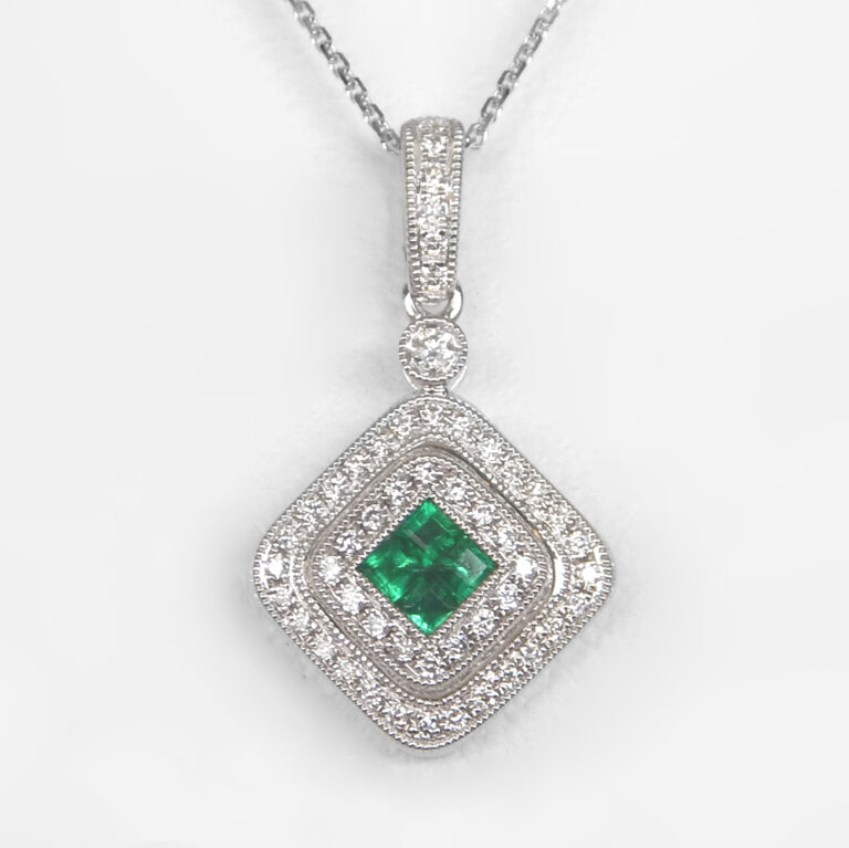 white gold emerald and diamond pendant