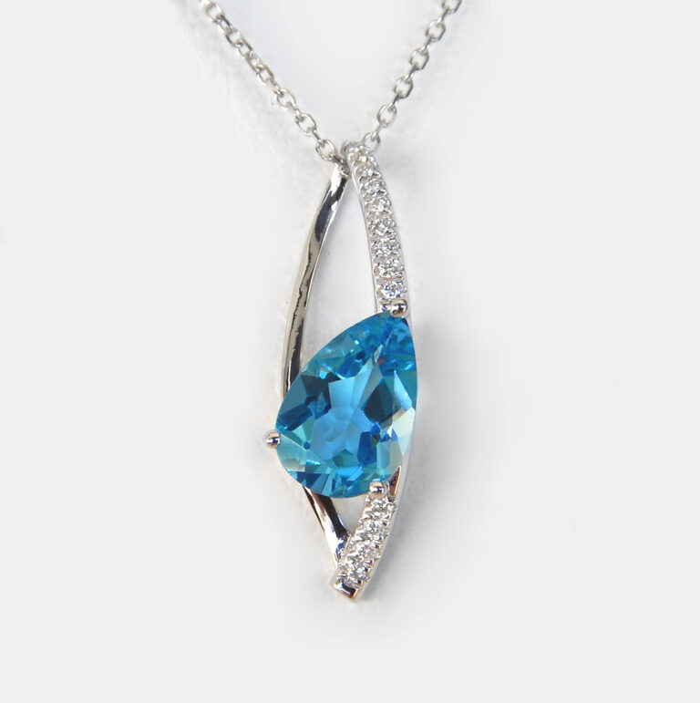 white gold blue topaz and diamond pendant