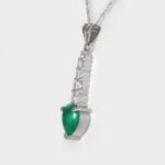 side view of platinum emerald and diamond pendant