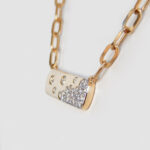 side view of yellow gold scattered diamond necklace