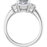 side view of white gold emerald cut three stone diamond engagement ring