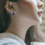 sterling silver blue teardrop earring on model