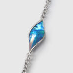 close up view of blue enamel sterling silver necklace