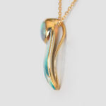 side view of yellow gold opal leaf pendant