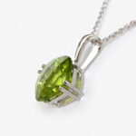 side view of white gold peridot pendant