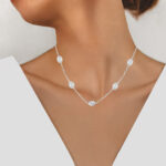 white gold diamond station necklace on model
