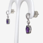 side view of amethyst and diamond dangle earrings