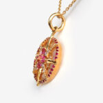 side view of yellow gold compass necklace