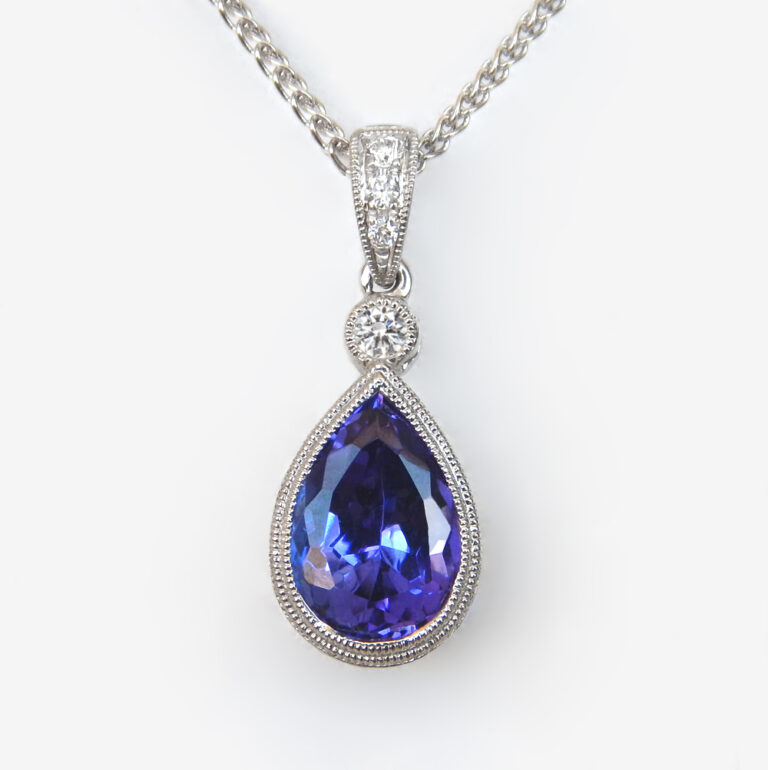 Click to view larger size white gold pear-shaped tanzanite and diamond pendant
