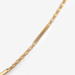 close up view of yellow gold necklace