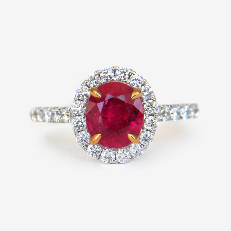 Click to view larger size white gold oval ruby and diamond ring