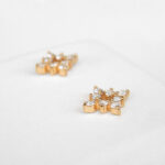 side view of yellow gold diamond starburst earrings