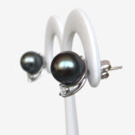 side view of white gold tahitian pearl and diamond studs